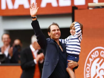 Tennis - French Open - Roland Garros, Paris, France - May 25, 2025 Former tennis player and record French Open winner Spain's Rafael Nadal and his son Rafael Nadal Junior during a tribute ceremony REUTERS/Lisi Niesner