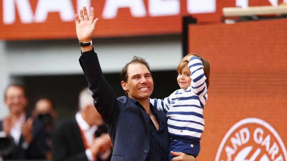 Tennis - French Open - Roland Garros, Paris, France - May 25, 2025 Former tennis player and record French Open winner Spain's Rafael Nadal and his son Rafael Nadal Junior during a tribute ceremony REUTERS/Lisi Niesner