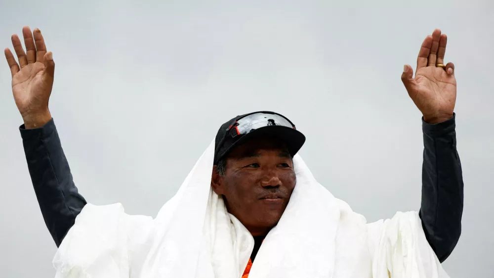 FILE PHOTO: Kami Rita Sherpa, 53, a Nepali mountaineer, waves towards the media personnel upon his arrival after climbing Mount Everest for the 28th time, creating a new record for the most summits of the world's highest mountain, in Kathmandu, Nepal May 25, 2023. REUTERS/Navesh Chitrakar/File Photo