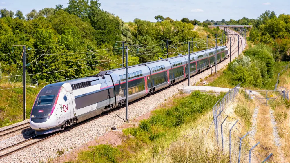 Ver-sur-Launette, France - July 29, 2020: A TGV Duplex inOui high speed train from french rail company SNCF is driving from Lille to Paris on the LGV Nord, the North European high speed railway line.