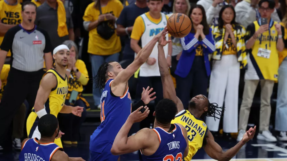 May 27, 2025; Indianapolis, Indiana, USA; Indiana Pacers center Myles Turner (33) and New York Knicks guard Jalen Brunson (11) battle for control of the ball during the fourth quarter of game four of the eastern conference finals for the 2025 NBA Playoffs at Gainbridge Fieldhouse. Mandatory Credit: Trevor Ruszkowski-Imagn Images