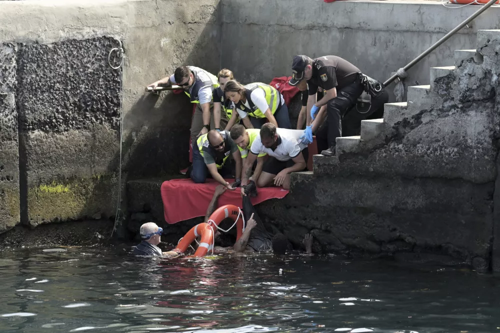 Survivors of a capsized boat are rescued in the port of El Hierro in the Canary Islands, Spain, on Wednesday, May 28, 2025.(Europa Press via AP) *