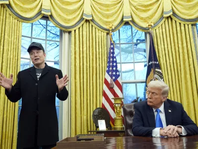 FILE - President Donald Trump listens as Elon Musk speaks in the Oval Office at the White House, Feb. 11, 2025, in Washington. (AP Photo/Alex Brandon, File)