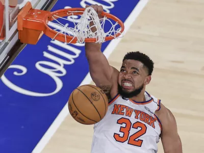 New York Knicks center Karl-Anthony Towns (32) scores against the Indiana Pacers during the fourth quarter of Game 5 of the NBA basketball Eastern Conference final, Thursday, May 29, 2025, in New York. (AP Photo/Adam Hunger)