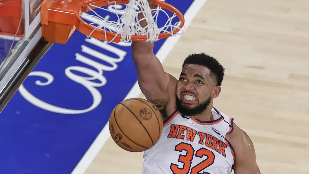 New York Knicks center Karl-Anthony Towns (32) scores against the Indiana Pacers during the fourth quarter of Game 5 of the NBA basketball Eastern Conference final, Thursday, May 29, 2025, in New York. (AP Photo/Adam Hunger)