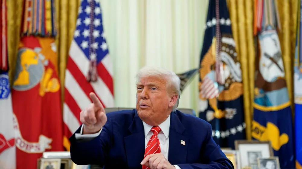U.S. President Donald Trump attends a press conference with Elon Musk (not pictured) in the Oval Office of the White House, in Washington, D.C., U.S., May 30, 2025. REUTERS/Nathan Howard