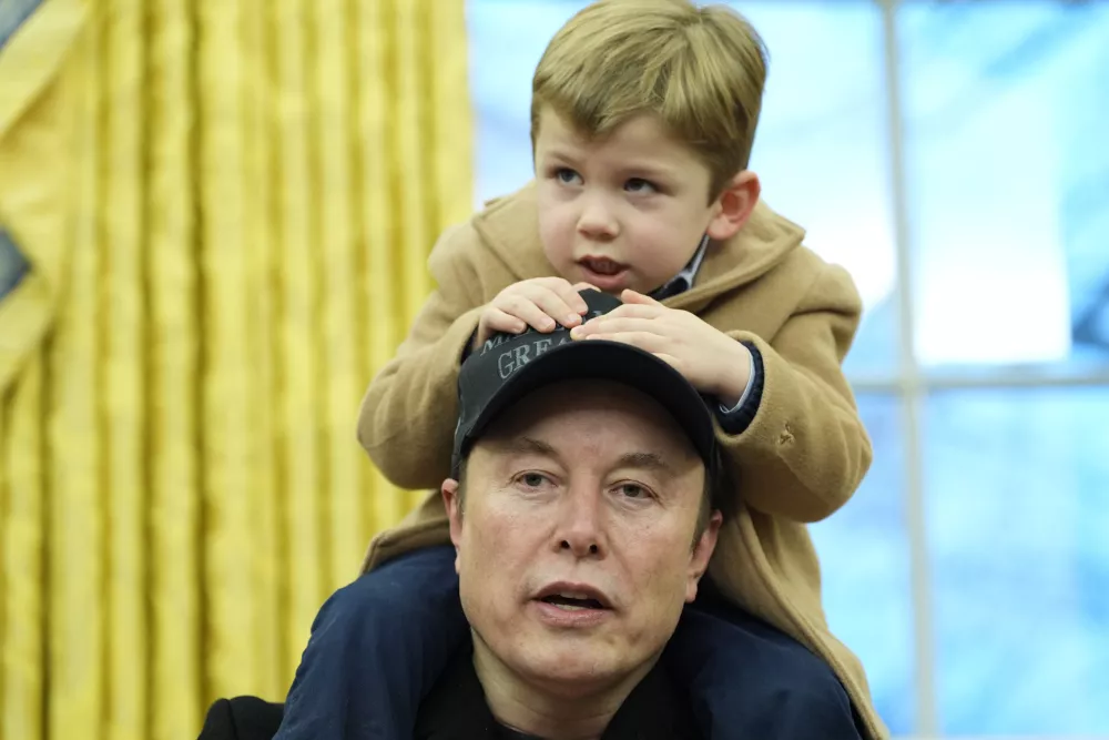 FILE - Elon Musk, joined by his son X &AElig; A-Xii, speaks in the Oval Office at the White House, Feb. 11, 2025, in Washington, during an event with President Donald Trump. (AP Photo/Alex Brandon, File)
