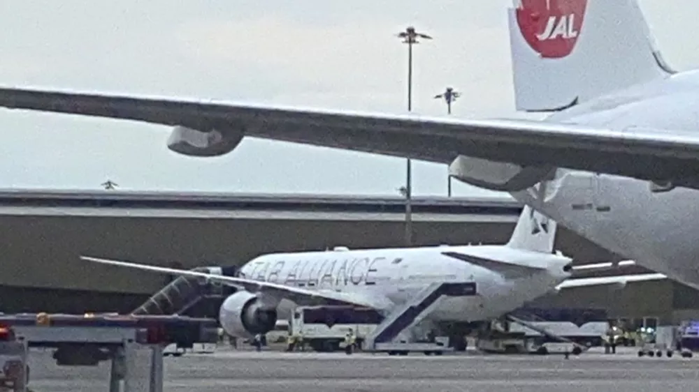 The Boeing 777-300ER aircraft of Singapore Airlines, flight SQ321 from Heathrow is seen on tarmac after requesting an emergency landing at Bangkok's Suvarnabhumi International airport, Thailand, Tuesday, May 21, 2024. One person has died aboard a London-Singapore flight that encountered severe turbulence, Singapore Airlines said Tuesday, in which the plane apparently plummeted for a number of minutes before it was diverted to Bangkok, where emergency crews rushed to help injured passengers amid stormy weather. (Pongsakorn Rodphai via AP)