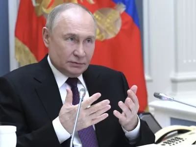 Russian President Vladimir Putin gestures while speaking via videoconference during a meeting of the Presidential Council for the Development of Physical Culture and Sport dedicated to promoting adaptive sports at the Kremlin in Moscow, Russia, Wednesday, May 28, 2025. (Alexey Nikolskiy, Sputnik, Kremlin Pool Photo via AP)