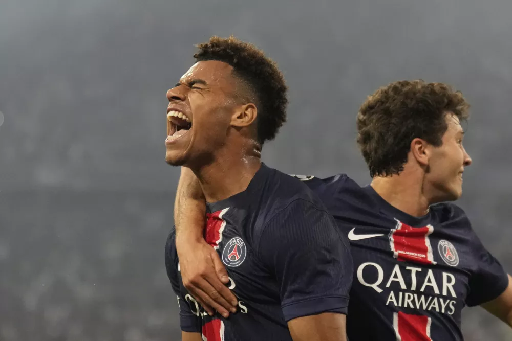 PSG's Desire Doue celebrates after scoring his side's second goal during the Champions League final soccer match between Paris Saint-Germain and Inter Milan at the Allianz Arena in Munich, Germany, Saturday, May 31, 2025. (AP Photo/Matthias Schrader)