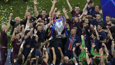 Players of PSG lift the trophy after winning the Champions League tournament at the Allianz Arena in Munich, Germany, Saturday, May 31, 2025. (AP Photo/Michael Probst)