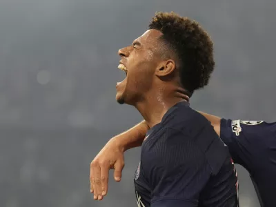 PSG's Desire Doue celebrates after scoring his side's second goal against Inter Milan during the Champions League final soccer match at the Allianz Arena in Munich, Germany, May 31, 2025. (AP Photo/Matthias Schrader)