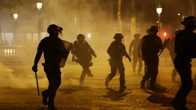 Soccer Football - Champions League - Final - Paris St Germain fans gather in Paris - Paris, France - May 31, 2025 Riot police on the Champs Elysees avenue after Paris St Germain won the Champions League REUTERS/Abdul Saboor