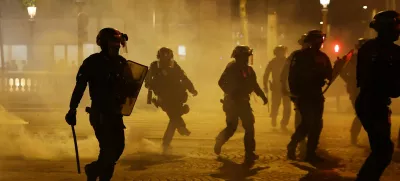 Soccer Football - Champions League - Final - Paris St Germain fans gather in Paris - Paris, France - May 31, 2025 Riot police on the Champs Elysees avenue after Paris St Germain won the Champions League REUTERS/Abdul Saboor