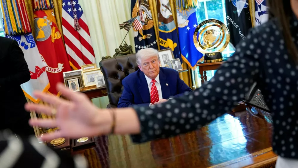 U.S. President Donald Trump sits in the Oval Office at the end of a press conference with Elon Musk (not pictured), at the White House, in Washington, D.C., U.S., May 30, 2025. REUTERS/Nathan Howard