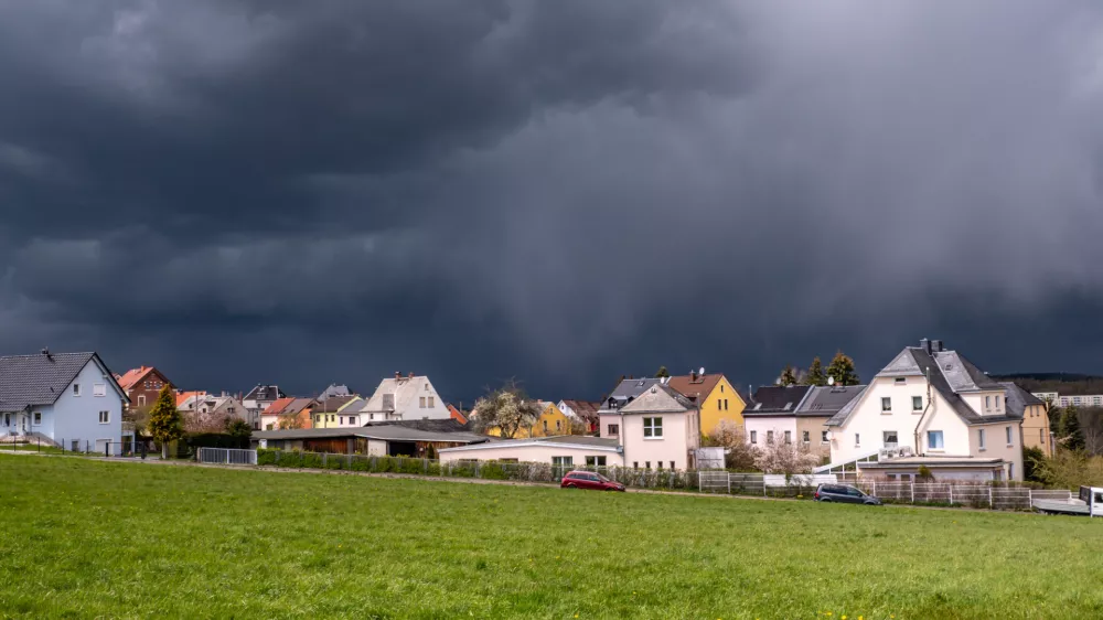 Storm clouds over a village