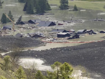 Check dams are seen on the waters of the Lonza river after the formation of a lake following landslides in Blatten, Switzerland, Sunday, June 1, 2025. (Cyril Zingaro/Keystone via AP)
