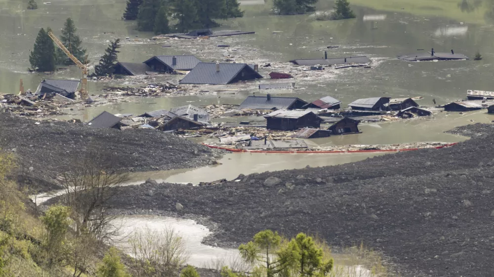 Check dams are seen on the waters of the Lonza river after the formation of a lake following landslides in Blatten, Switzerland, Sunday, June 1, 2025. (Cyril Zingaro/Keystone via AP)