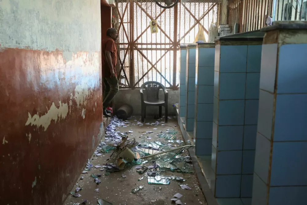 A man looks next to the damage at the prisoners visiting hall inside Malir Jail, after dozens of prisoners escaped from the jail, on the outskirts of Karachi, Pakistan, June 3, 2025. REUTERS/Akhtar Soomro