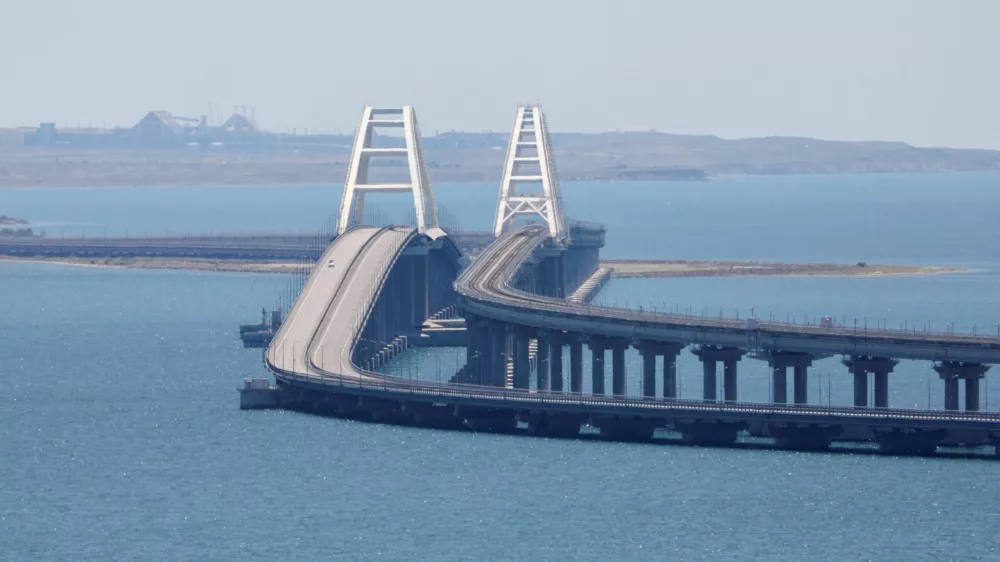 FILE PHOTO: A view shows the Crimean Bridge, a section of which was damaged by an alleged overnight attack, as seen form the city of Kerch, Crimea, July 17, 2023. REUTERS/Alexey Pavlishak/File Photo