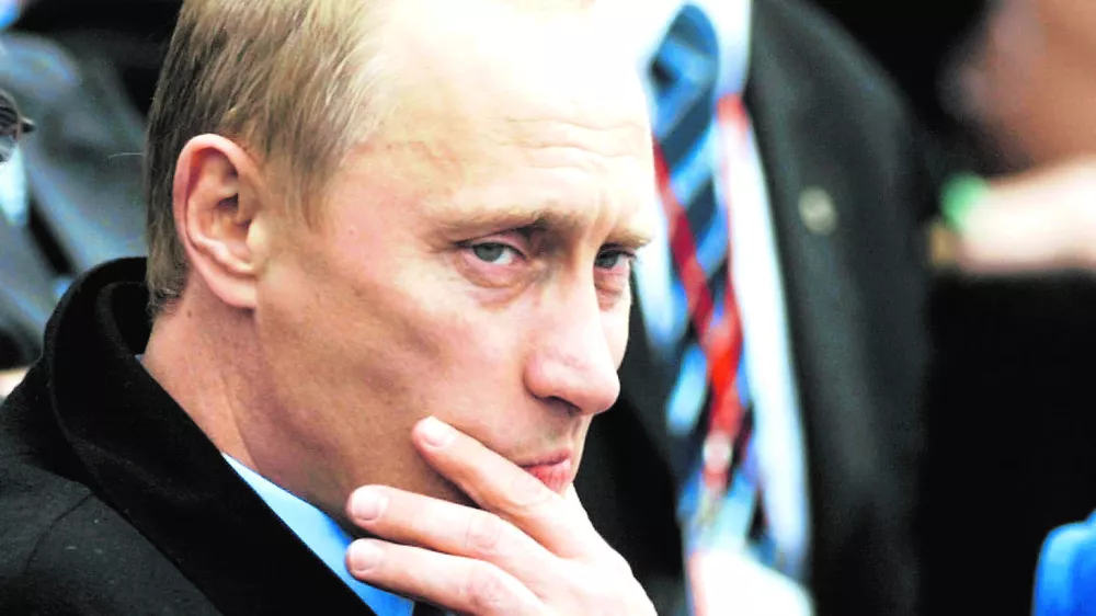 Russian President Vladimir Putin ponders a moment during opening ceremonies commemorating the 300th anniversary of St. Petersburg, on the banks of the Neva river in St. Petersburg, Russia, Saturday, May 31, 2003. (AP Photo/CP, Tom Hanson)------4k