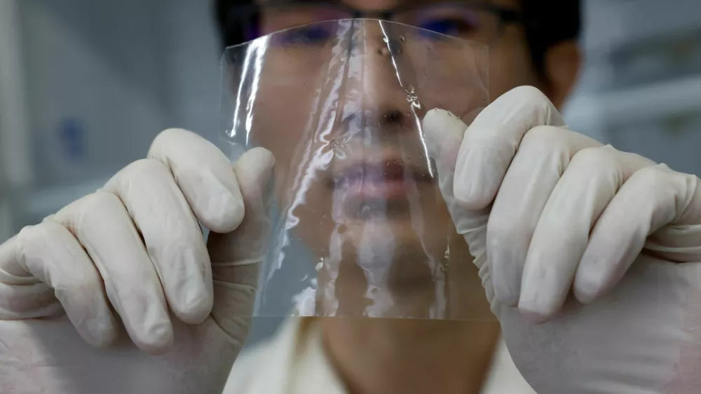 A researcher shows a sample of ocean-degradable plastic at the Center for Emergent Matter Science (CEMS) of Japanese research institution Riken in Wako, Saitama Prefecture, Japan May 27, 2025. REUTERS/Manami Yamada