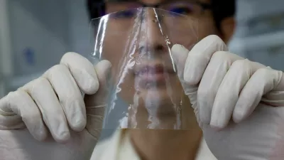 A researcher shows a sample of ocean-degradable plastic at the Center for Emergent Matter Science (CEMS) of Japanese research institution Riken in Wako, Saitama Prefecture, Japan May 27, 2025. REUTERS/Manami Yamada