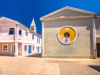 Novigrad Istarski colorful square architecture view, solar clock, Istria region of Croatia