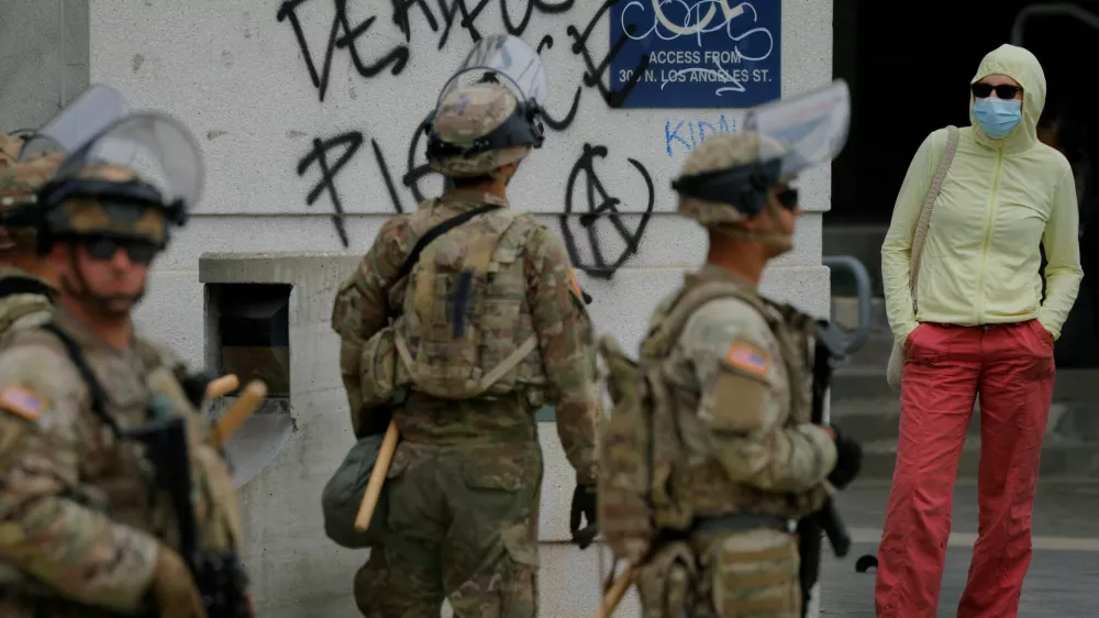 Members of the California National Guard stand outside the Edward R. Roybal federal building after their deployment by U.S. President Donald Trump, in response to protests against immigration sweeps, in Los Angeles, California, U.S. June 8, 2025. REUTERS/Mike Blake
