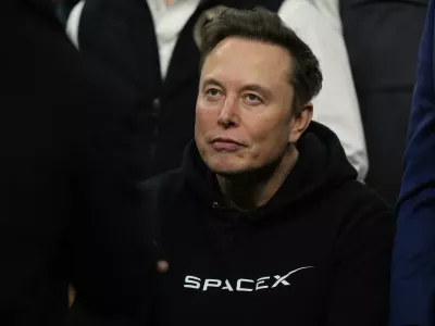FILE - Elon Musk attends the finals for the NCAA wrestling championship, Saturday, March 22, 2025, in Philadelphia. (AP Photo/Matt Rourke, file)