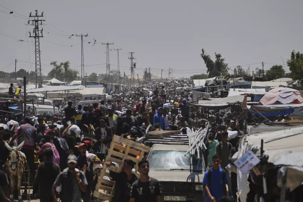 Palestinians heading to receive food and humanitarian aid packages from the Gaza Humanitarian Foundation, a U.S.-backed organization, in Rafah, southern Gaza Strip, Monday, June 9, 2025. (AP Photo/Abdel Kareem Hana)