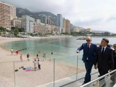 France's President Emmanuel Macron and Prince Albert II of Monaco walk on the seaside after visiting the 'thalassothermic' marine thermal energy company SeaWergie during a two-day state visit in Monaco ahead of the Unoc3, on June 8, 2025. LUDOVIC MARIN/Pool via REUTERS