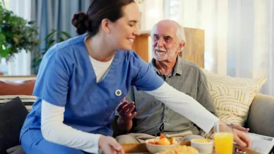 Breakfast, nurse and senior man in nursing home for elderly care, nutrition and support. Retired male person, caregiver and service for hungry patient in assisted living, healthcare and wellness / Foto: Jacob Wackerhausen