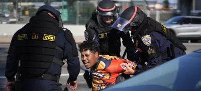 A protester is arrested by California Highway Patrol near the federal building in downtown Los Angeles on Tuesday, June 10, 2025. (AP Photo/Eric Thayer)