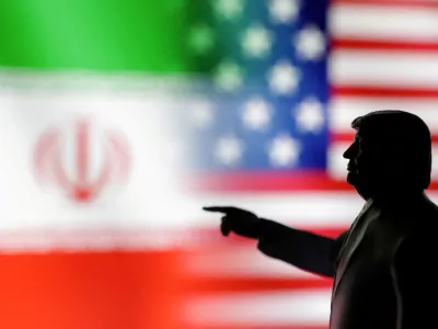 FILE PHOTO: A 3D-printed miniature model depicting U.S. President Donald Trump, Iranian and U.S. flags in this illustration taken, April 17, 2025. REUTERS/Dado Ruvic/Illustration/File Photo