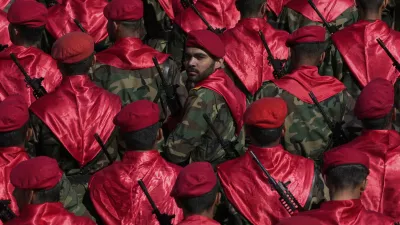 FILE - An Iranian army member looks back among others, as they conclude their march, during a parade commemorating National Army Day in front of the shrine of the late revolutionary founder Ayatollah Khomeini, just outside Tehran, Iran, Friday, April 18, 2025. (AP Photo/Vahid Salemi, File)