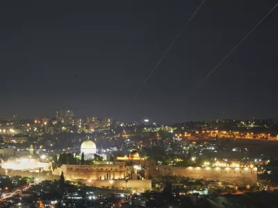 Traces are seen over Jerusalem during a missile attack alert, Friday, June 13, 2025. (AP Photo/Ohad Zwigenberg)