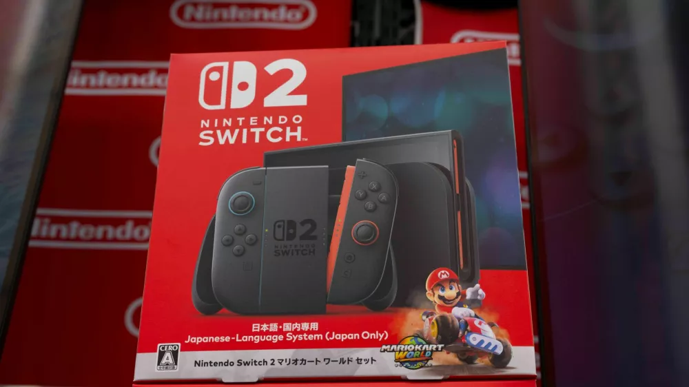 3BF1B9R In this photo illustration, the Nintendo Switch 2 advertisement seen displayed at an electronics store. The Nintendo Switch 2 is set to launch on June 5 with a starting price of $449.99 for the base console and $499.99 for a bundle including Mario Kart World. Pre-orders began on April 24 2025 in the U.S. through retailers like GameStop, Best Buy, Walmart and Target but stock sold out quickly due to high demand. Nintendo's My Nintendo Store uses a registration-based invite system with the first wave of invites sent out starting May 8, 2025 prioritizing Nintendo Switch Online members with at lea