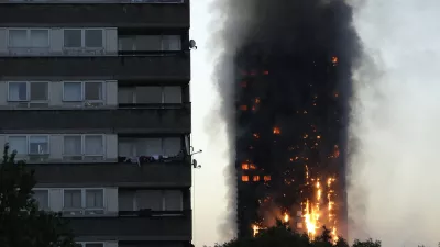 FILE - In this Wednesday, June 14, 2017 file photo smoke and flames rise from the Grenfell Tower high-rise building in west London. (AP Photo/Matt Dunham, File)