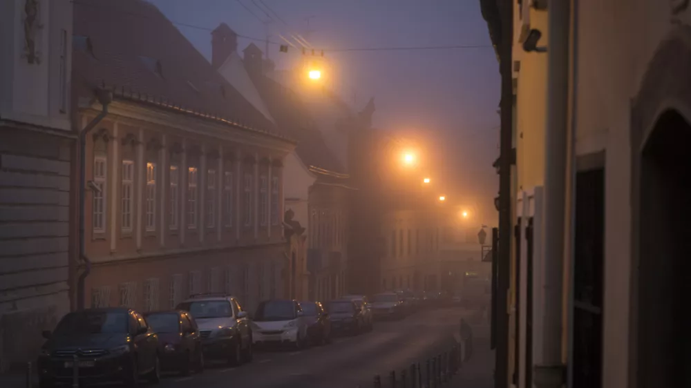 Street in fog in the Upper Town at night in winter, Zagreb, Croatia