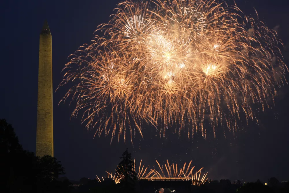 Fireworks burst over the Ellipse during an event to honor the Army's 250th anniversary, coinciding with President Donald Trump's 79th birthday, Saturday, June 14, 2025, in Washington. (AP Photo/Mark Schiefelbein)