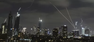 The Israeli Iron Dome air defense system fires to intercept missiles over Tel Aviv, Israel, Sunday, June 15, 2025. (AP Photo/Leo Correa)