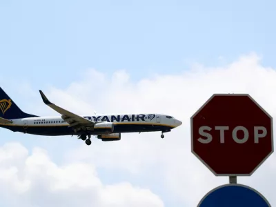 A Ryanair airplane passes a Stop sign as it lands at Barcelona-El Prat airport, the day before a cabin crew strike is to be held in European countries, in Barcelona, Spain, July 24, 2018. REUTERS/Albert Gea