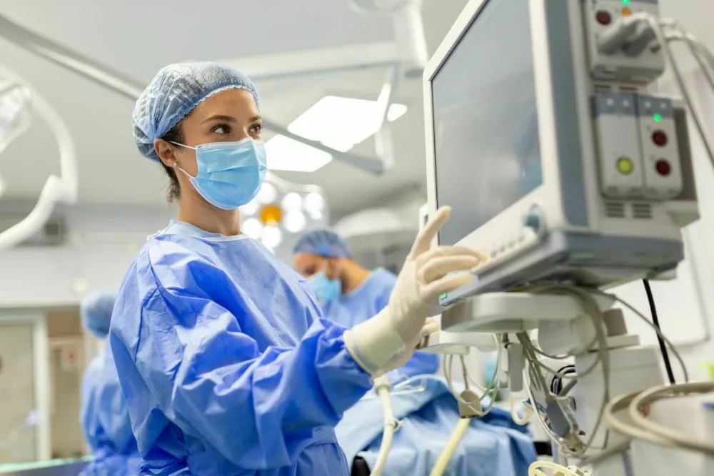 Concentrated Surgical team operating a patient in an operation theater. Well-trained anesthesiologist with years of training with complex machines follows the patient throughout the surgery.