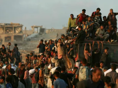 Palestinians gather to receive aid supplies in Beit Lahia, in the northern Gaza Strip, June 17, 2025. REUTERS/Stringer