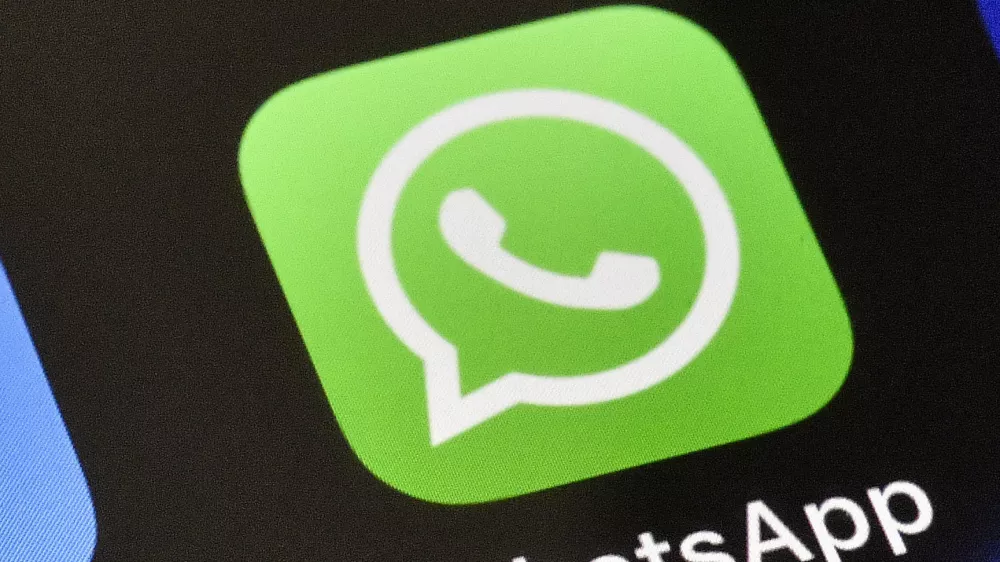 FILE - A WhatsApp icon is displayed on an iPhone, Nov. 15, 2018, in Gelsenkirchen, Germany. (AP Photo/Martin Meissner, File)