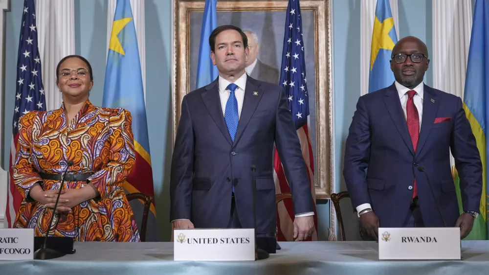 FILE - Secretary of State Marco Rubio hosts a signing ceremony in which Congo's Foreign Minister Therese Kayikwamba Wagner, left, and Rwanda's Foreign Minister Olivier Nduhungirehe, right, pledge to work toward a peace deal at the State Department in Washington, April 25, 2025. (AP Photo/Jacquelyn Martin, File)