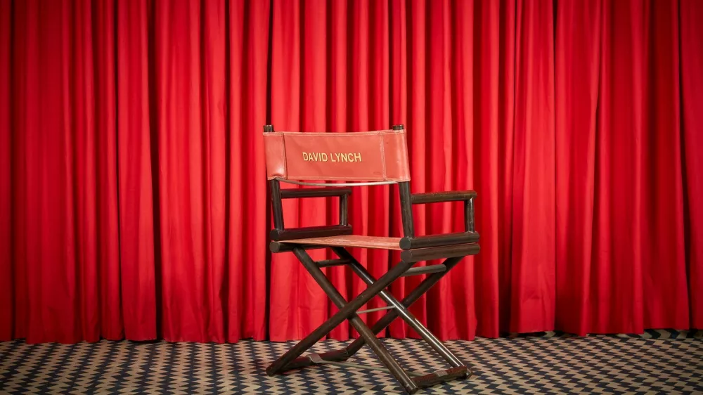 David Lynch's director's chair emblazoned with his name on the back ($5,000 - $7,000); his personally owned Twin Peaks Black Lodge style red curtain and black and white zig-zag rug ($1,000 - $2,000).   A treasure trove of over 450 personal artifacts from the late filmmaker David Lynch is to be auctioned. The event offers fans and collectors a rare opportunity to own pieces from the visionary director's five-decade career and personal life. The collection spans Lynch's legendary work in film and television&mdash;including Twin Peaks, Mulholland Drive, Eraserhead, The Elephant Man, and Blue Velvet&mdash;and features items from his home, studio, and woodshop.,Image: 1004881051, License: Rights-managed, Restrictions: Editorial use, commercial use may require additional licenses. We don't use AI to make images which could be mistaken for news photos. AI use will be clearly indicated. Supplied on condition you ensure personal data is processed in compliance with UK GDPR, Model Release: noFoto: Profimedia