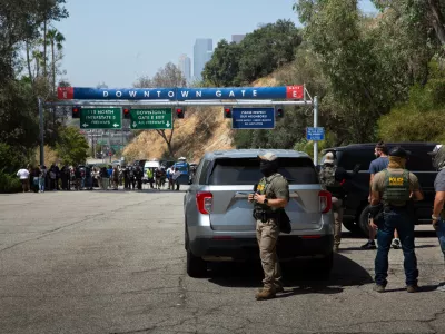 20 June 2025, US, Los Angeles: Border Patrol agents stand at Gate E of Dodger Stadium in Los Angeles. The Dodgers denied them access, stating that immigration agents are not allowed on the property. The agents said no one was detained. Photo: Zin Chiang/dpa
