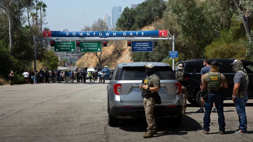 20 June 2025, US, Los Angeles: Border Patrol agents stand at Gate E of Dodger Stadium in Los Angeles. The Dodgers denied them access, stating that immigration agents are not allowed on the property. The agents said no one was detained. Photo: Zin Chiang/dpa